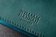 William Hannah Dark Green leather and Blue suede A5 notebook: cover logo