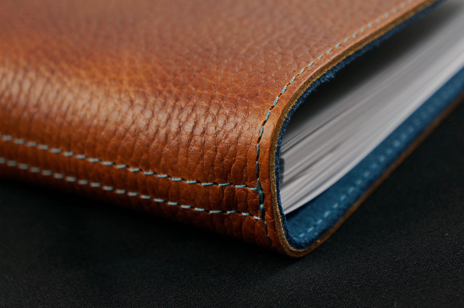 William Hannah textured tan leather and blue suede A6 notebook: spine detail
