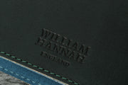 William Hannah dark green leather and blue suede A6 notebook: cover logo
