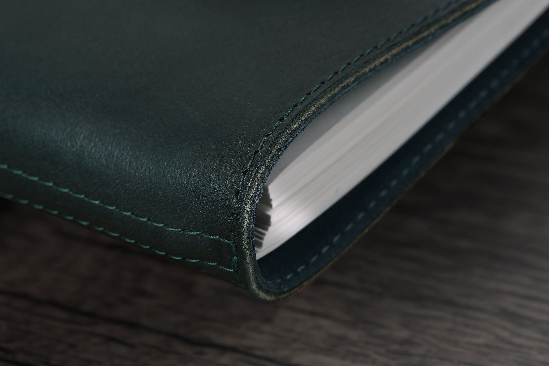 William Hannah dark green leather and blue suede A6 notebook: spine detail