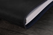 William Hannah black leather and navy suede A6 notebook: spine detail