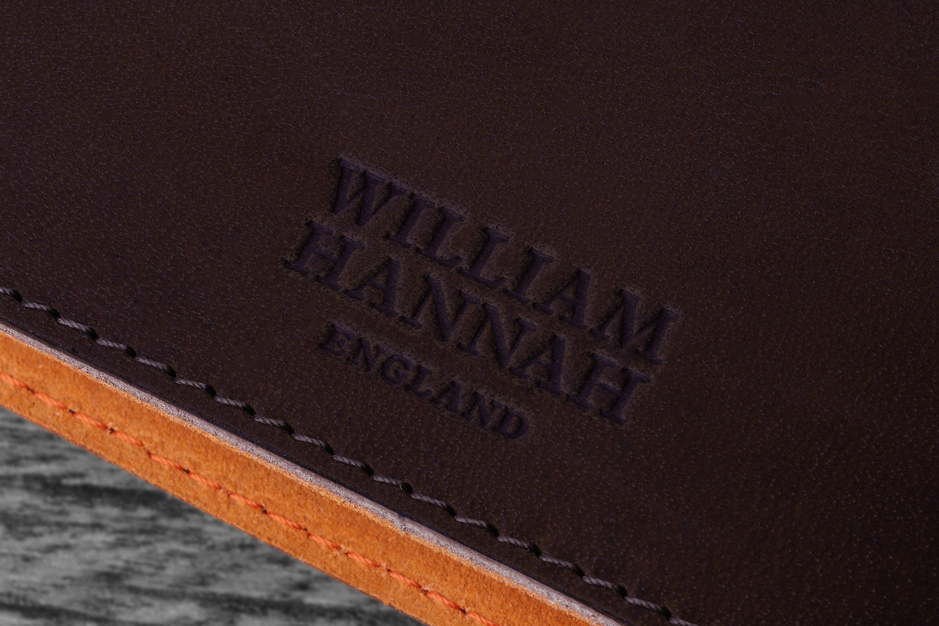William Hannah dark brown leather and orange suede A6 notebook: cover logo
