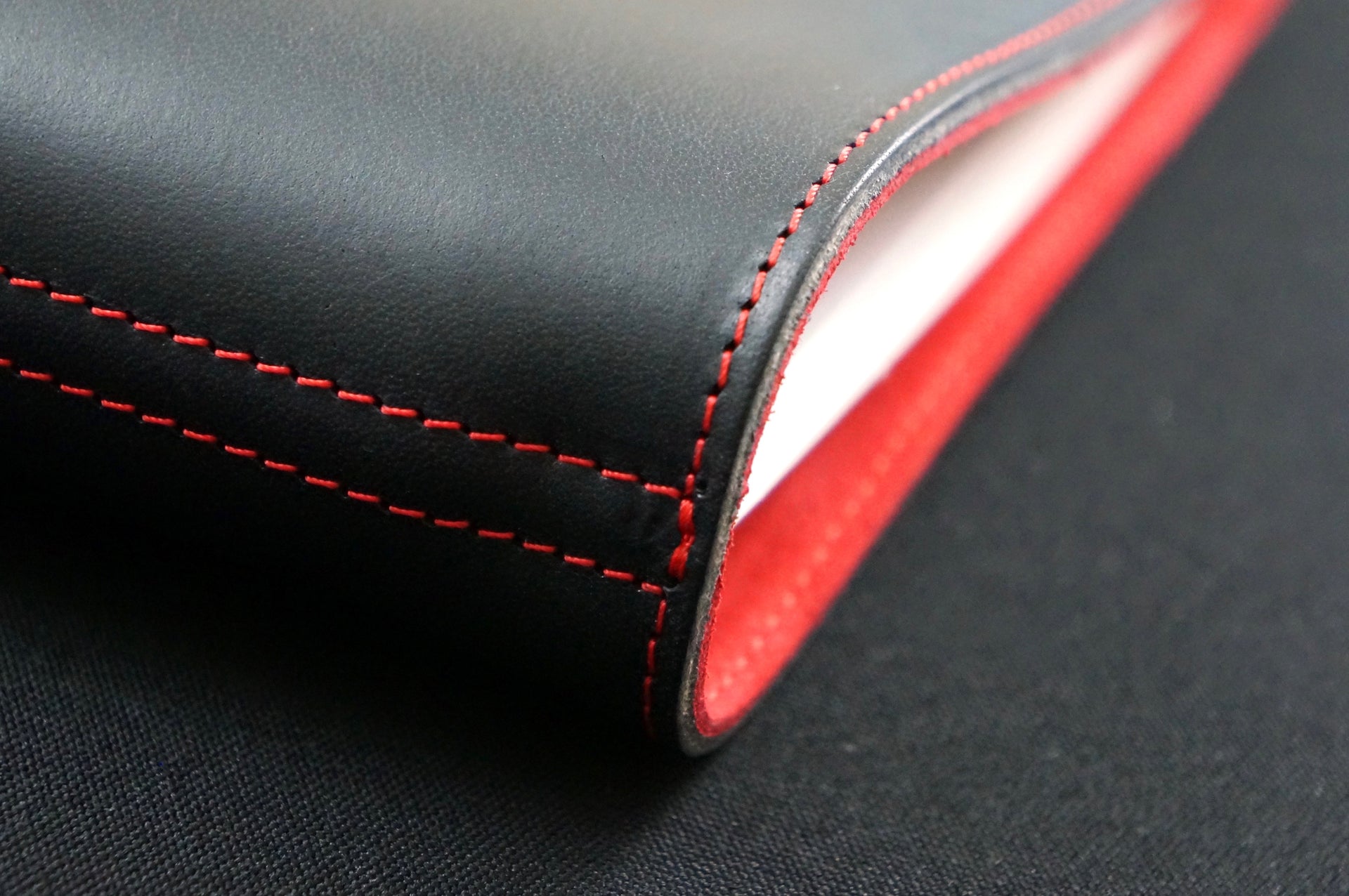 William Hannah Black leather and Red suede A5 notebook: spine detail