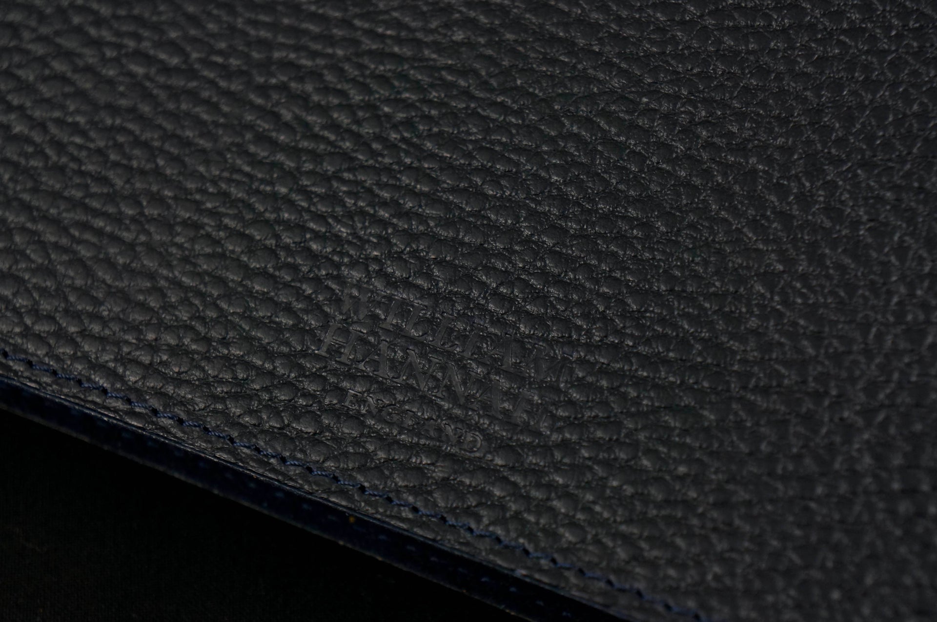 William Hannah Black leather and Navy suede A5 notebook: leather texture and cover logo