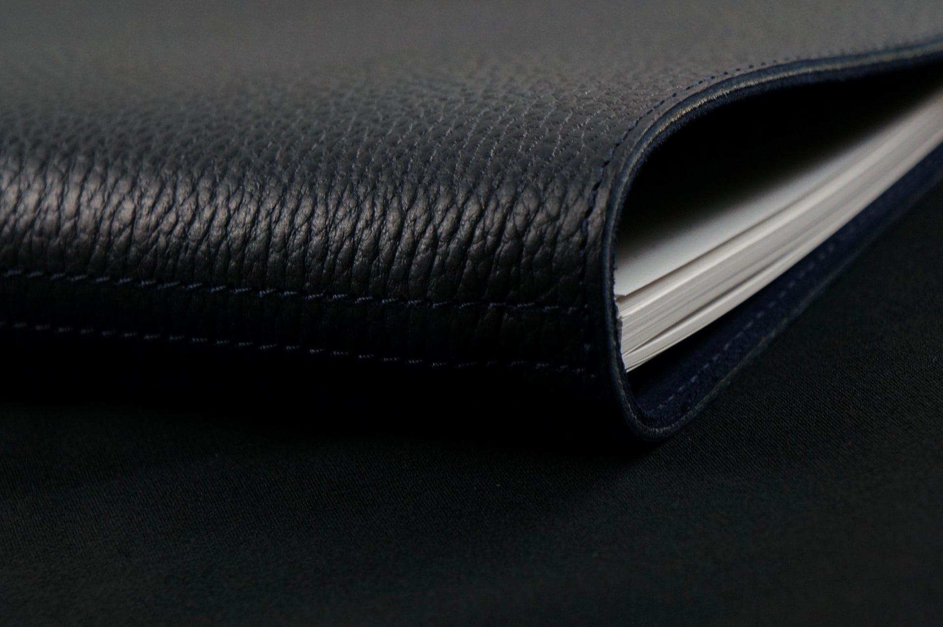 William Hannah Black leather and Navy suede A5 notebook: spine detail