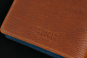 William Hannah textured tan leather and blue suede A6 notebook: cover logo