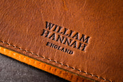 William Hannah Tan leather and Orange suede A5 notebook: cover logo